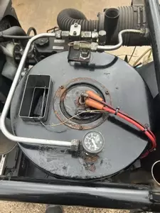 Burner assembly reinstalled on Nilfisk Contractor diesel hot pressure washer after boiler repair.